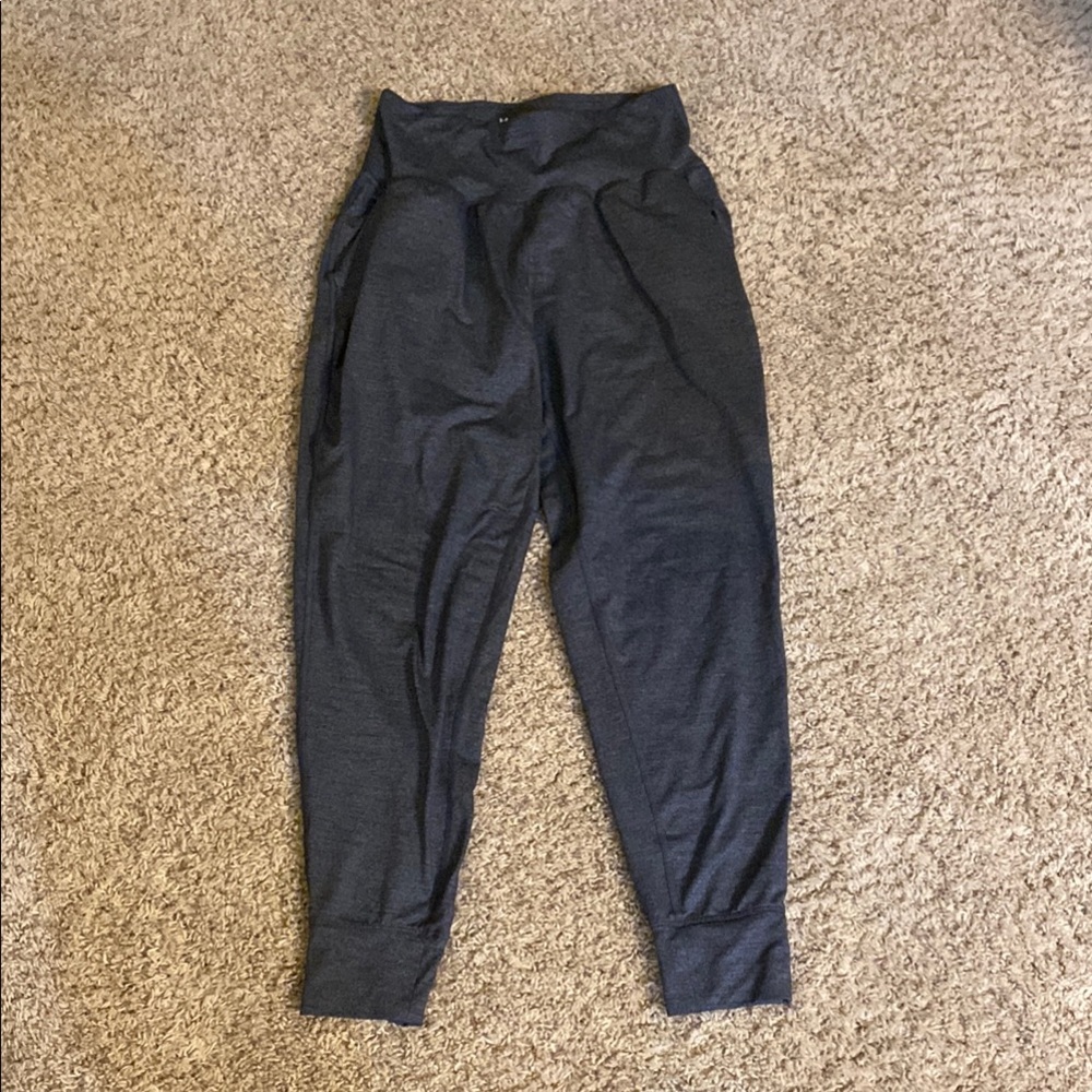 Woman’s size small Under Armour loose fit Jogger Pants. Navy heather in color.